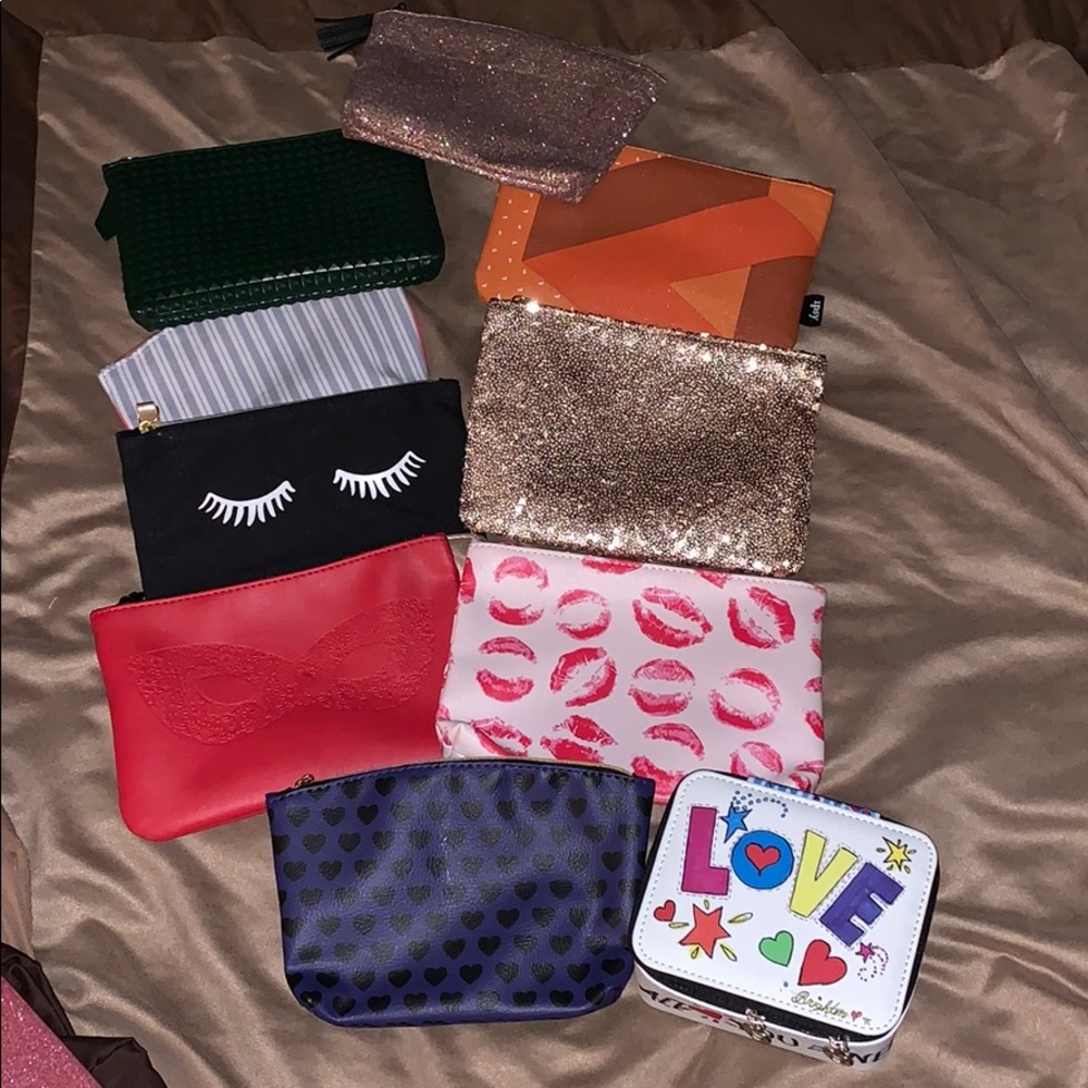9 make up bags and a Brighton box. All new